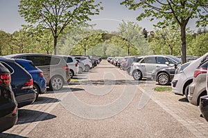 row of cars in parking lot