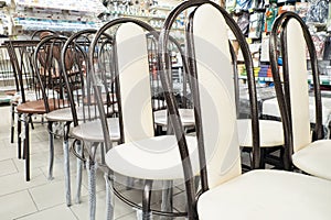 A row of chairs. Consumerism. Retail trade. Household goods