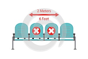 Row of chairs with prohibited marks. Airports or subway keeping social distancing norms. Covid-19 prevention. Coronavirus pandemic