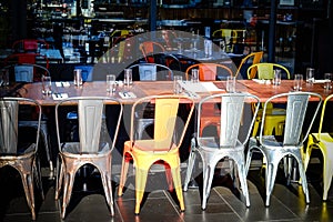 Row of chairs and tables in an empty restaurant