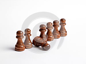 Row of chess pawns with one pawn fell in line. Weak link in the team or employee burnout and exhaustion