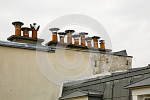 Row of Chimney Pots atop a Parisian Building photo