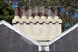 Row of chimney pots on roof of historic cottage