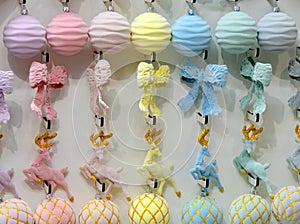 A row of Christmas balls in pastel colors