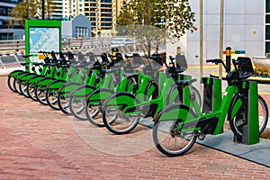 Row of city bikes parking for rent in Dubai