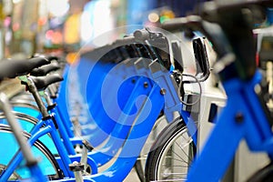 Row of city bikes for rent at docking stations