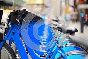 Row of city bikes for rent at docking stations