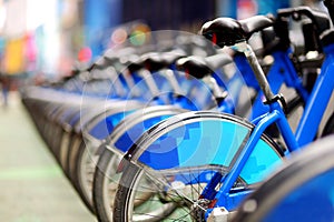 Row of city bikes for rent at docking stations