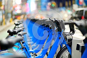 Row of city bikes for rent at docking stations