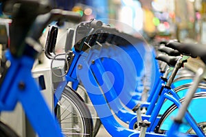 Row of city bikes for rent at docking stations in New York