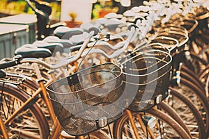 Row of city parked bicycles bikes for rent on sidewalk. Bike Bicycle Parking