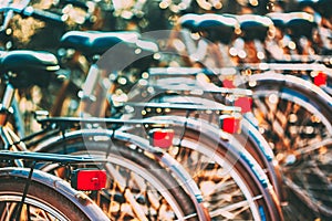 Row of city parked bicycles bikes for rent on sidewalk in European City Stockholm, Sweden