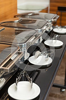 Row of closed chafing dishes