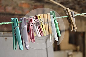 Row of clothes pins on a plastic string