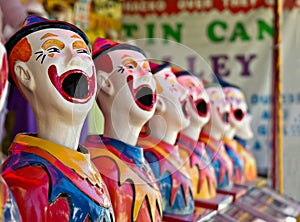 Row of clowns at fete or fair photo