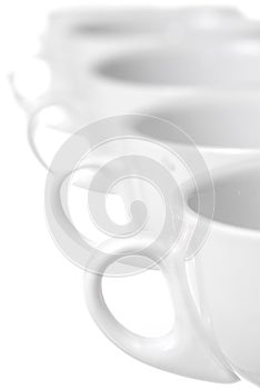 Row of Coffee Cups on White Background.