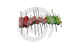Row of color-coded vintage metal-film resistors with leads for through-hole mounting. isolated on white background, with clipping