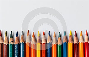 Row of Colored Pencils Against White Background