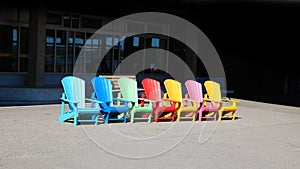 Row of colorful chairs near ferry harbor