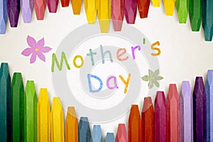Row of colorful crayon with mothers day message