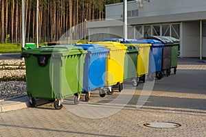 A row of colorful dustbins