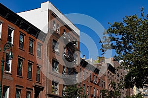 Row of Colorful Old Brick Apartment Buildings in Hell\'s Kitchen of New York City