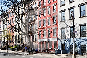 Row of colorful old buildings on 10th Street in the East Village of New York City photo