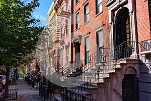 Row of Colorful Old Homes in Greenpoint Brooklyn New York along the Sidewalk