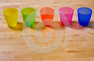 Row of colorful plastic cups
