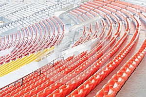 Row of colorful seats at the football stadium.