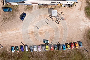 row of colorful stylish vintage Fiat 126 PanCars rental cars, aerial drone view