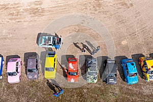 row of colorful stylish vintage Fiat 126 PanCars rental cars, aerial drone view