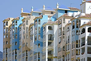 Row of colorful sunny apartments in Spain
