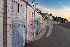 Row of colourful beach huts on Lyme Regis seafront