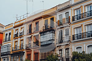 Row of colourful buildings on a street in Seville, Spain