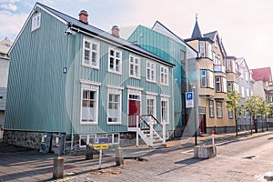 Row of colourful houses along a street in a city centre