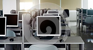 computers neatly placed in computer lab