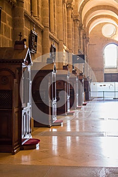 Row of confessional in catholic cathedral in soft light and unfocused. Empty wooden condessional. Church interior. Place for pray.