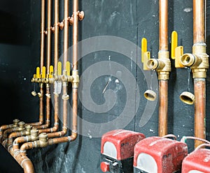 Row of copper pipes and valves