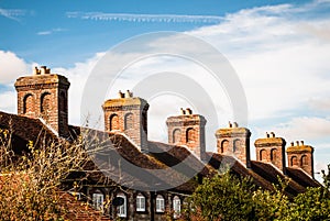 Row of cottages with brick chimneys