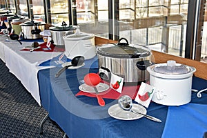 Row of crock pots for chili cook off