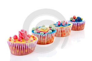 Row cupcakes with marzipan decoration