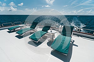 A row of deckchairs on a yacht