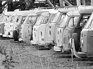 Row of defunct and run down desolate vans of all type