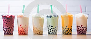a row of different colored bubble teas