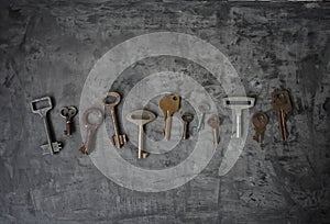 Row of different old and rusty keys