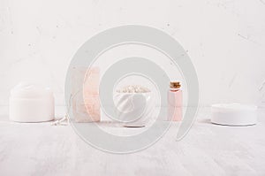 Row of different white and pink spa products for body and skin care as elegance fashion cosmetic background, copy space.