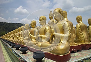 Row of disciple statues surrounding Big buddha statue