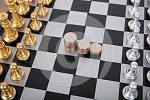 A row of dollar coins in the center of the chess board and chess in a standoff