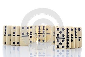 Row of dominoes on white background